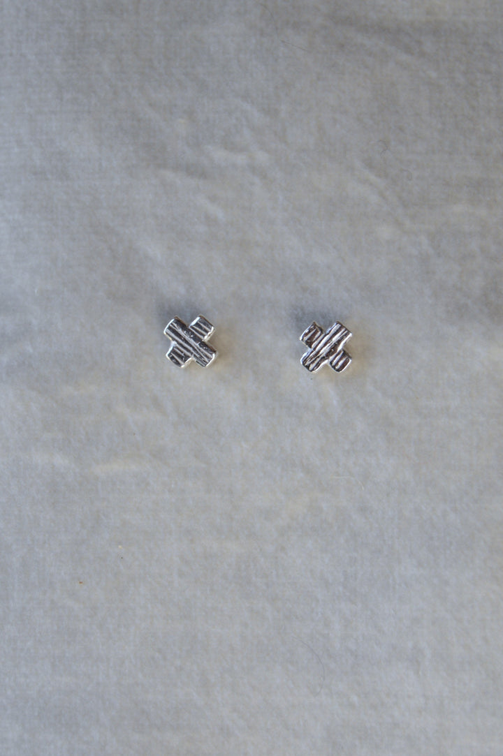 Silver X shape studs. From the noughts & crosses collection mini stud one size.
Mini XO shape stud charm silver earrings XO gift for her gift for him silver charm earrings