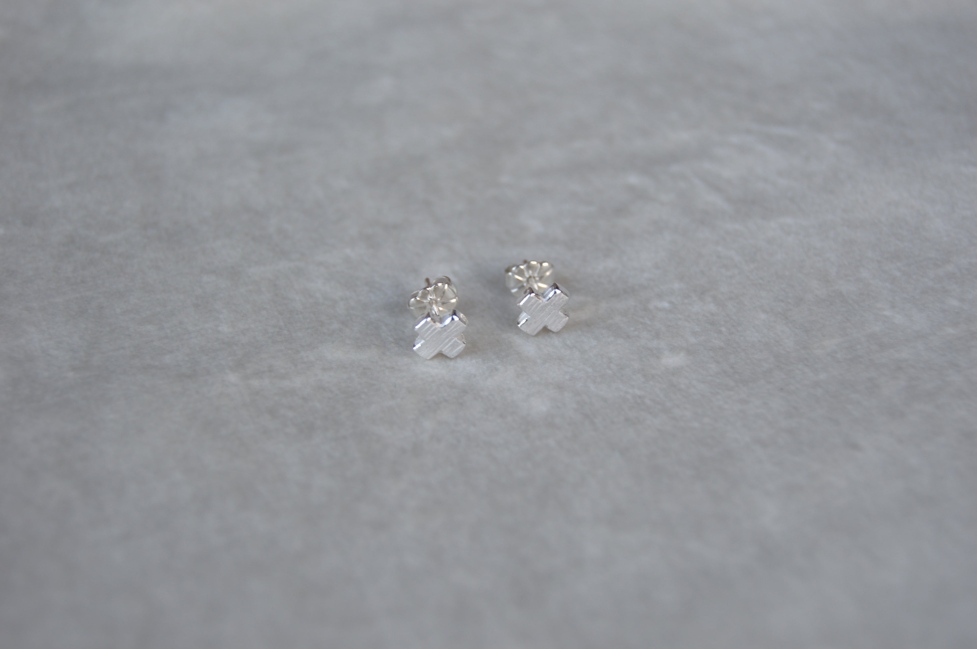 Silver X shape studs. From the noughts & crosses collection mini stud one size.
Mini XO shape stud charm silver earrings XO gift for her gift for him silver charm earrings
