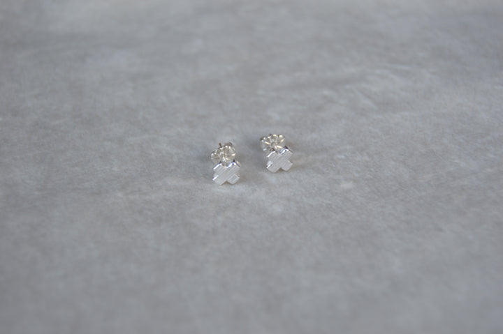 Silver X shape studs. From the noughts & crosses collection mini stud one size.
Mini XO shape stud charm silver earrings XO gift for her gift for him silver charm earrings