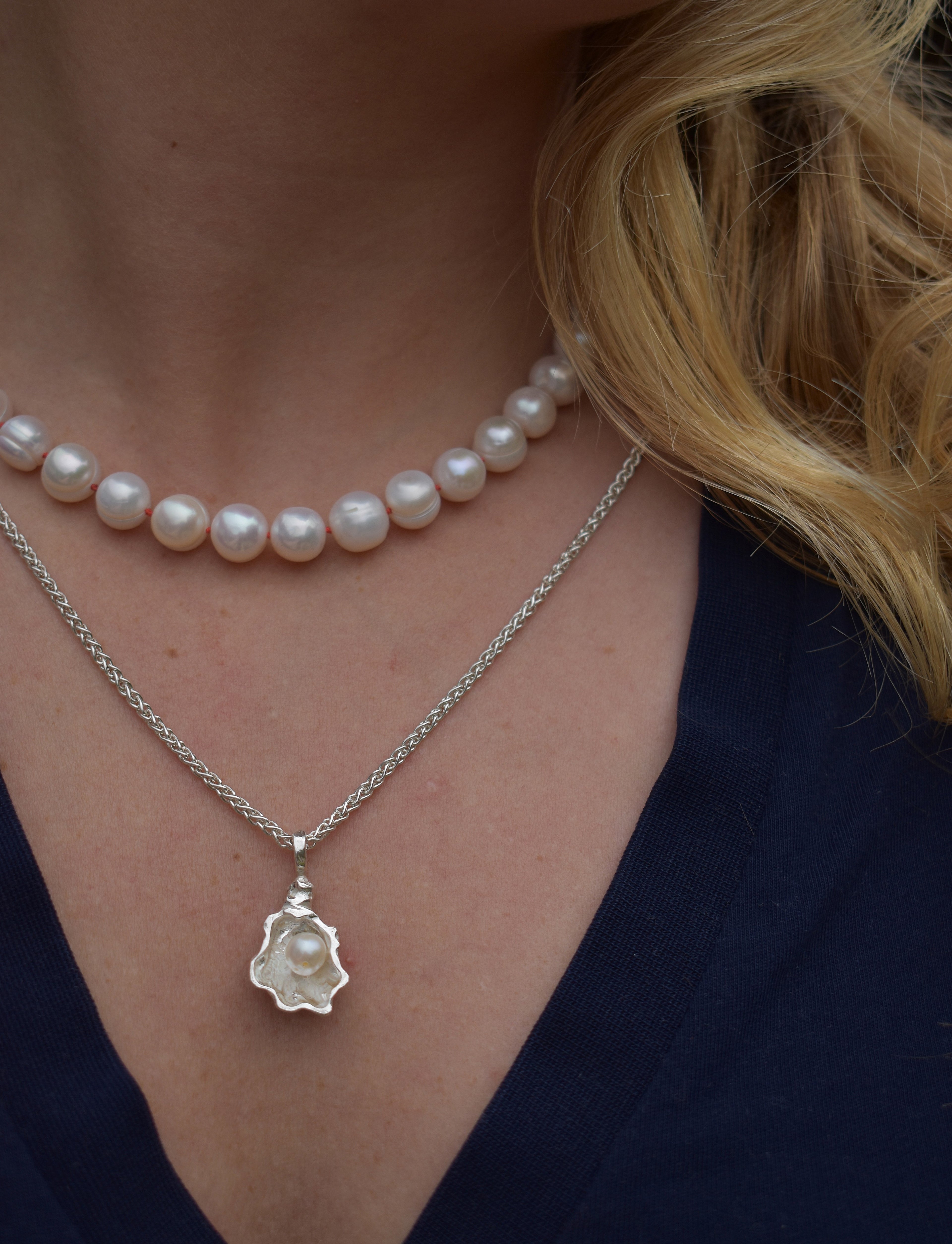 Large freshwater pearl hand strung necklace. Round, imperfect hand knotted with natural silk and set with a solid silver clasp. Pearl necklace choker style Ivory breakfast at tiffanys necklace