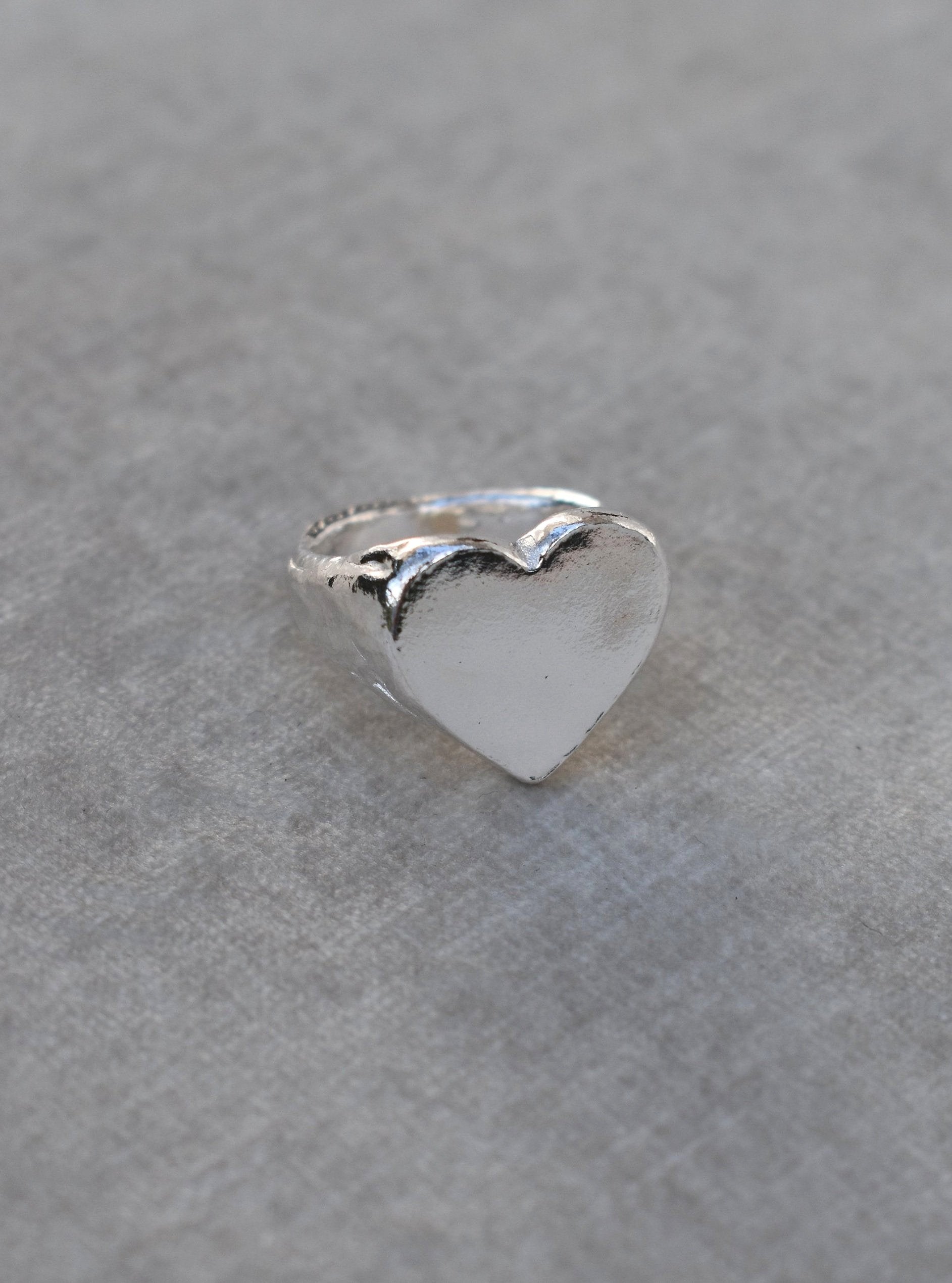 Classic love heart ring in silver. Luxury big chunky heart-shaped signet ring. Made from 100% recycled silver, hallmarked and stamped with individual maker’s mark. This heart ring is a perfect gift to the person that you love. Signature heart ring a timeless classic that goes with any style ladies statement heart signet ring