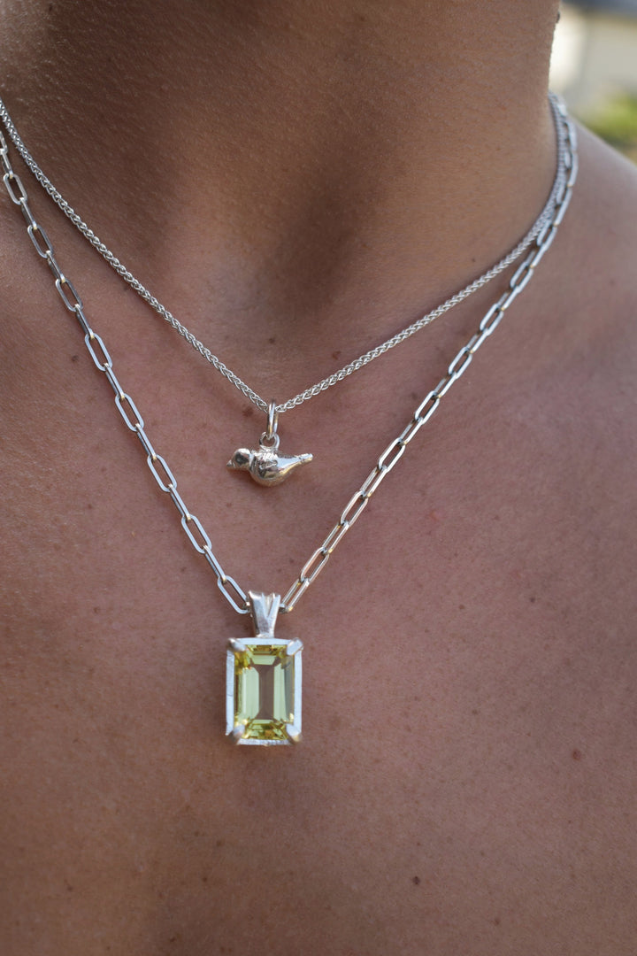 mini hand carved bird charm on silver trace chain. Silver bird charm represents love and freedom and spring time. charm necklace silver necklace layering 21st birthday gift mother's day gift mother and daughter necklace