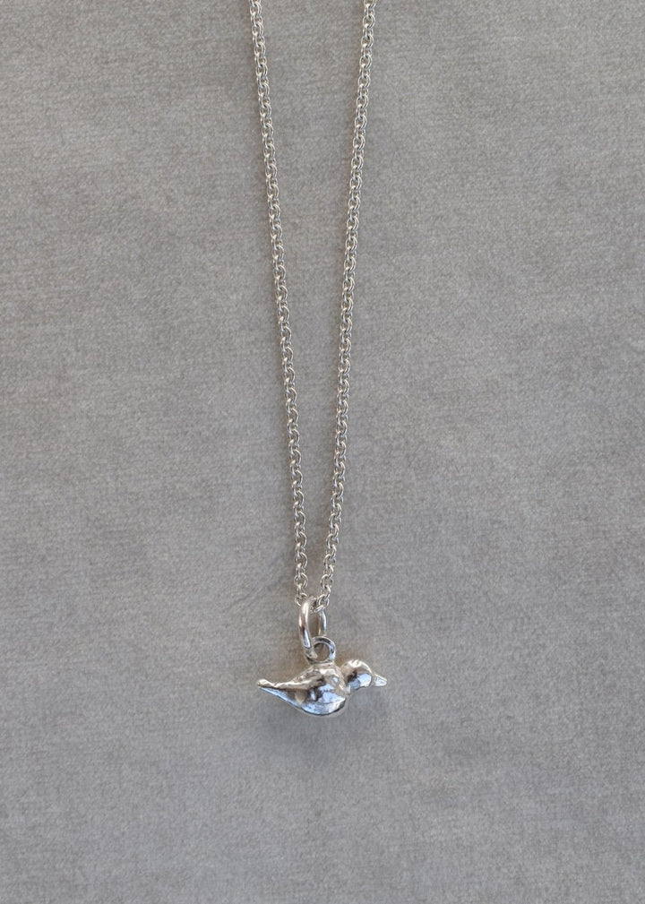 mini hand carved bird charm on silver trace chain. Silver bird charm represents love and freedom and spring time. charm necklace silver necklace layering 21st birthday gift mother's day gift mother and daughter necklace