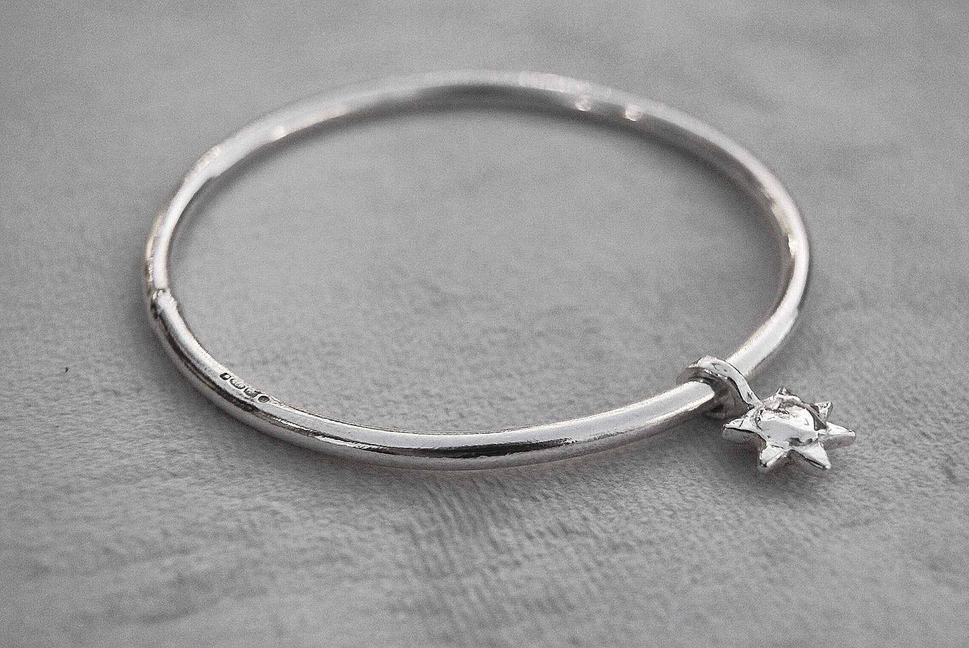 Solid silver round wire bangle with a mini sunshine charm. Can be worn alone or with a combination of other bangles from the collection. Round thick silver stack bangle silver cuff charm bracelet round solid silver bangle ladies bracelet with charm personalised word bracelet bangle stack silver