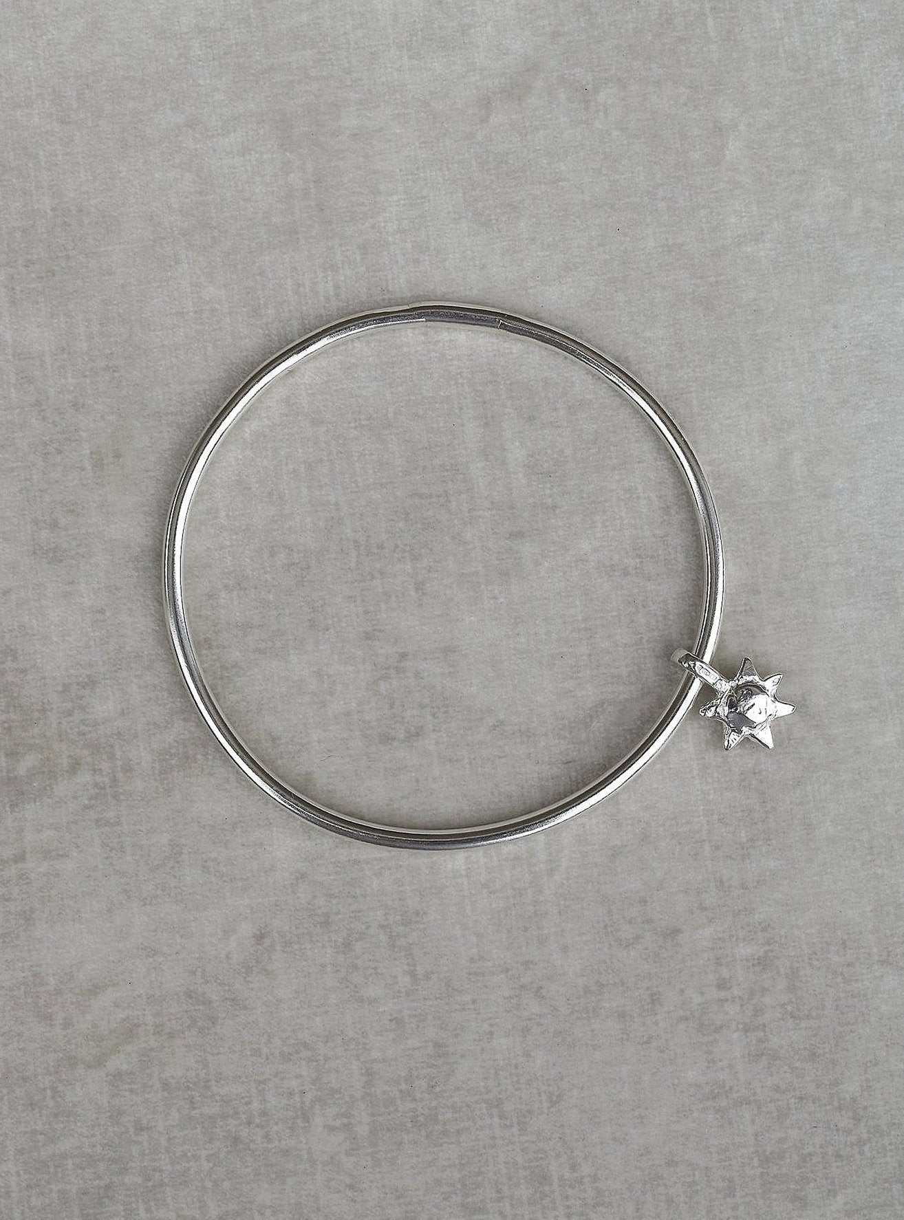 Solid silver round wire bangle with a mini sunshine charm. Can be worn alone or with a combination of other bangles from the collection. Round thick silver stack bangle silver cuff charm bracelet round solid silver bangle ladies bracelet with charm personalised word bracelet