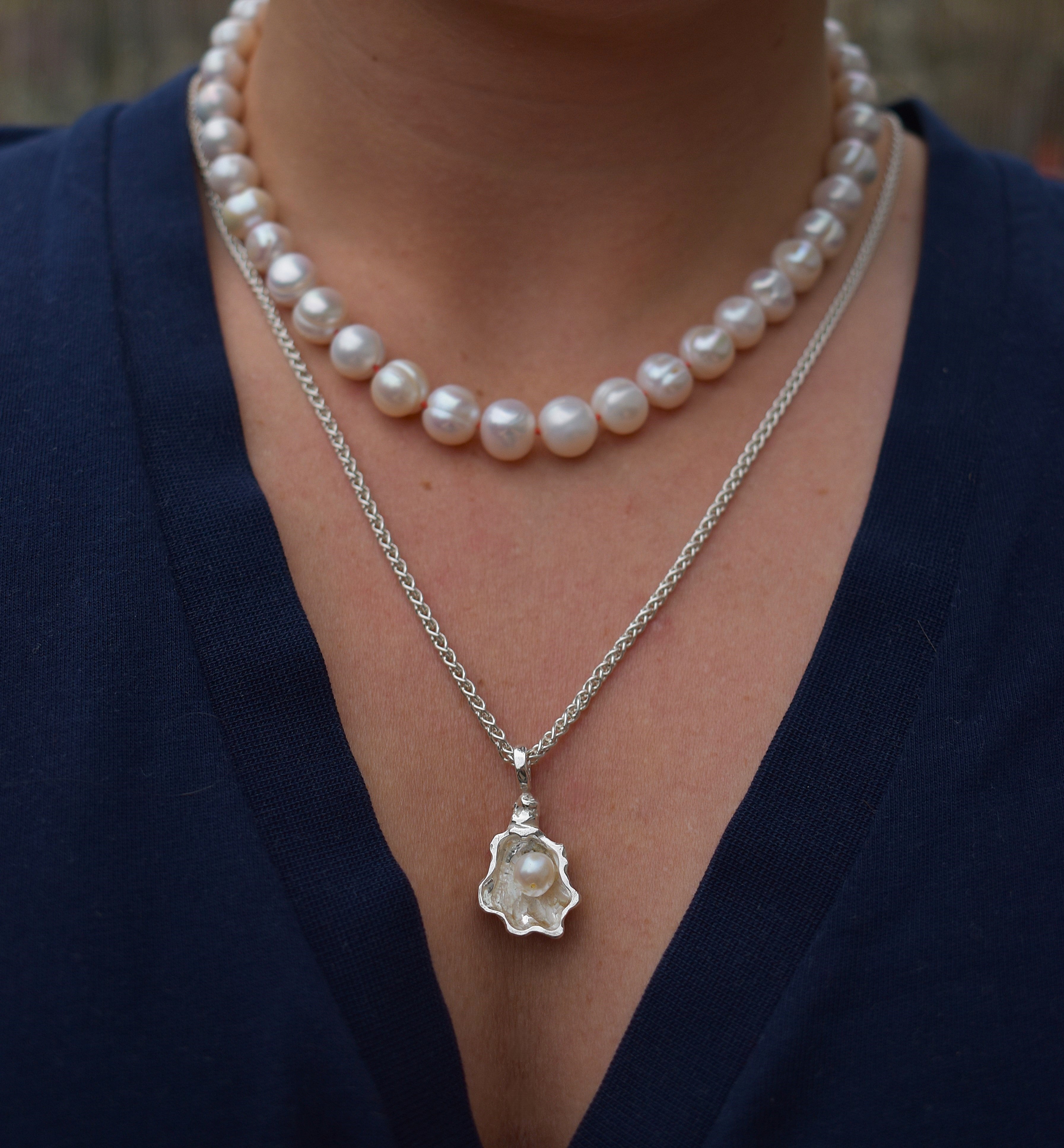 Large freshwater pearl hand strung necklace. Round, imperfect hand knotted with natural silk and set with a solid silver clasp. Pearl necklace choker style Ivory breakfast at tiffanys necklace