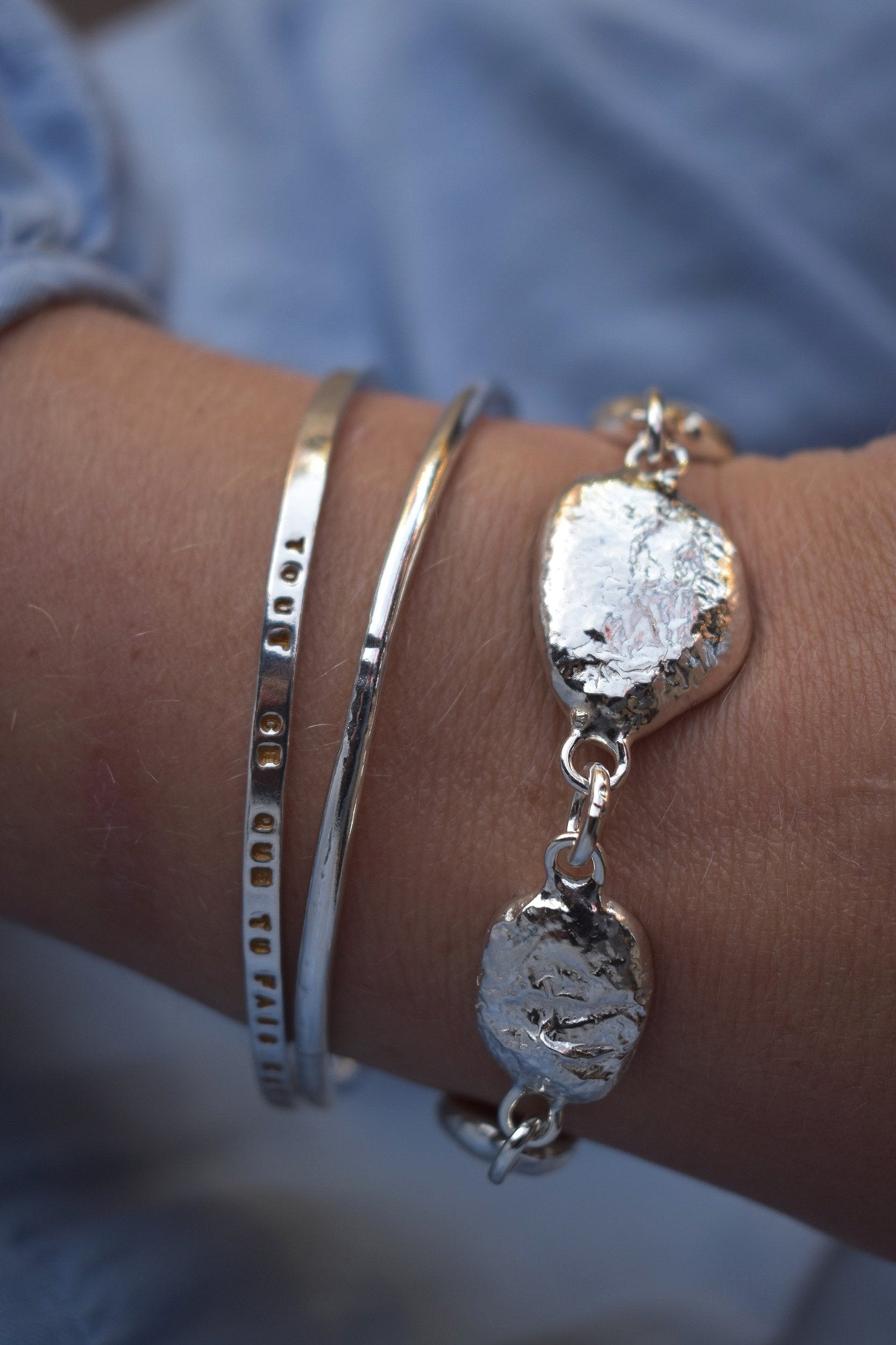 Unique silver pebble links make up this heavy bracelet. Made to order from recycled silver each pebble is totally unique. Hallmarked for silver.
Chunky silver nugget heavy silver charm bracelet. Heavy link chain bracelet