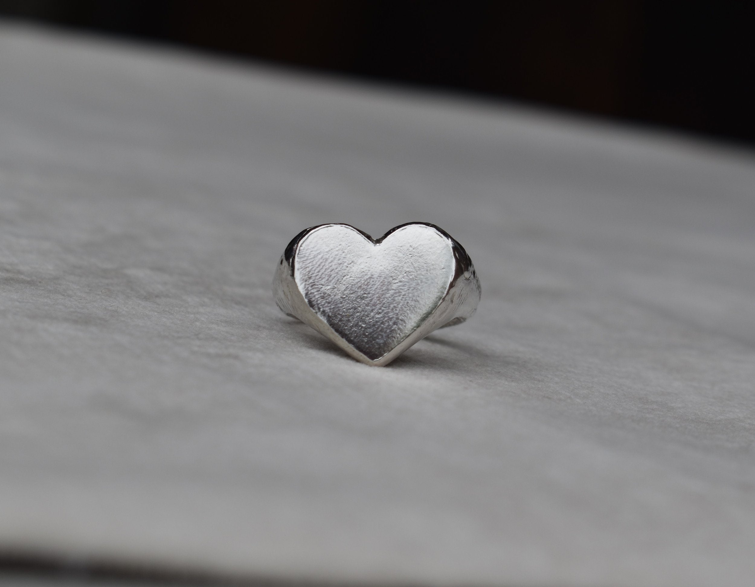 Classic love heart ring in silver. Luxury big chunky heart-shaped signet ring. Made from 100% recycled silver, hallmarked and stamped with individual maker’s mark. This heart ring is a perfect gift to the person that you love. Signature heart ring a timeless classic that goes with any style ladies statement heart signet ring