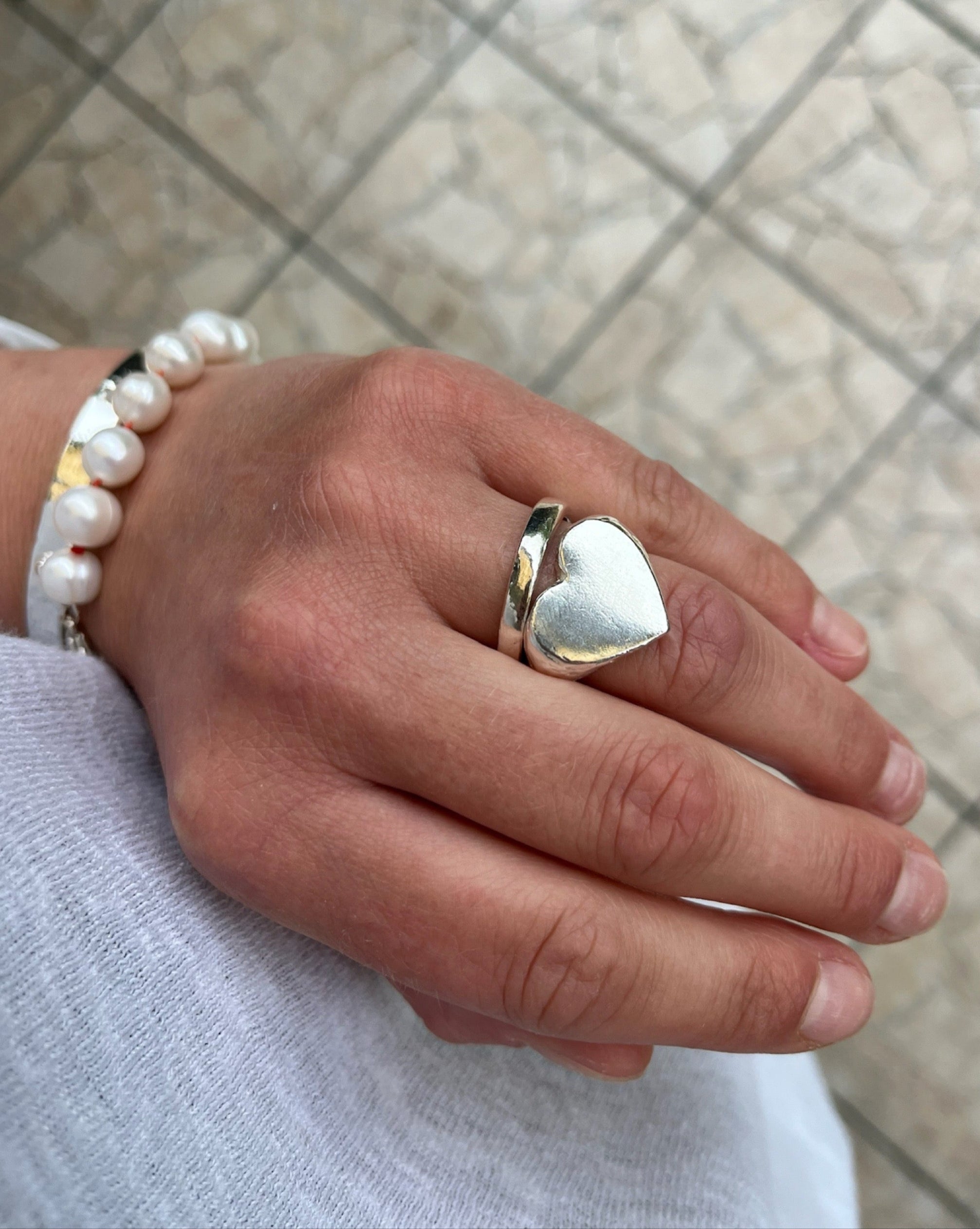 Classic love heart ring in silver. Luxury big chunky heart-shaped signet ring. Made from 100% recycled silver, hallmarked and stamped with individual maker’s mark. This heart ring is a perfect gift to the person that you love. Signature heart ring a timeless classic that goes with any style ladies statement heart signet ring
