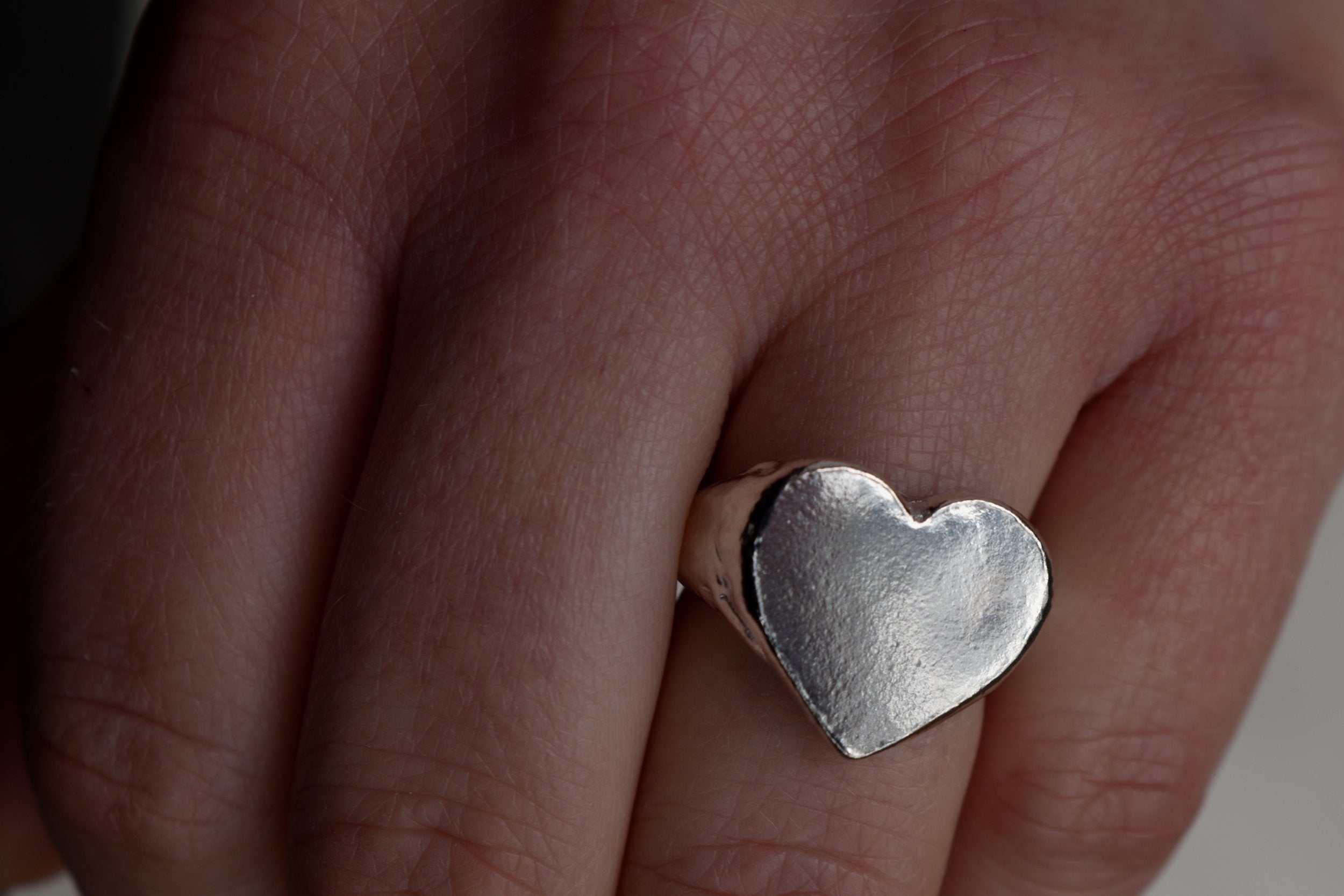Classic love heart ring in silver. Luxury big chunky heart-shaped signet ring. Made from 100% recycled silver, hallmarked and stamped with individual maker’s mark. This heart ring is a perfect gift to the person that you love. Signature heart ring a timeless classic that goes with any style ladies statement heart signet ring