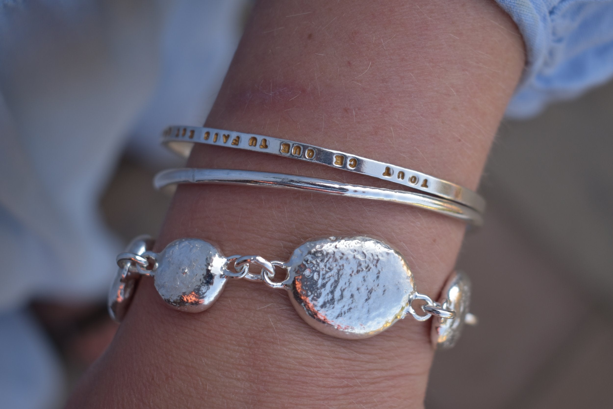 Unique silver pebble links make up this heavy bracelet. Made to order from recycled silver each pebble is totally unique. Hallmarked for silver. silver nugget chain bracelet silver charms linked together. heavy silver pebble bracelet
Chunky silver nugget heavy silver charm bracelet. Heavy link chain bracelet
