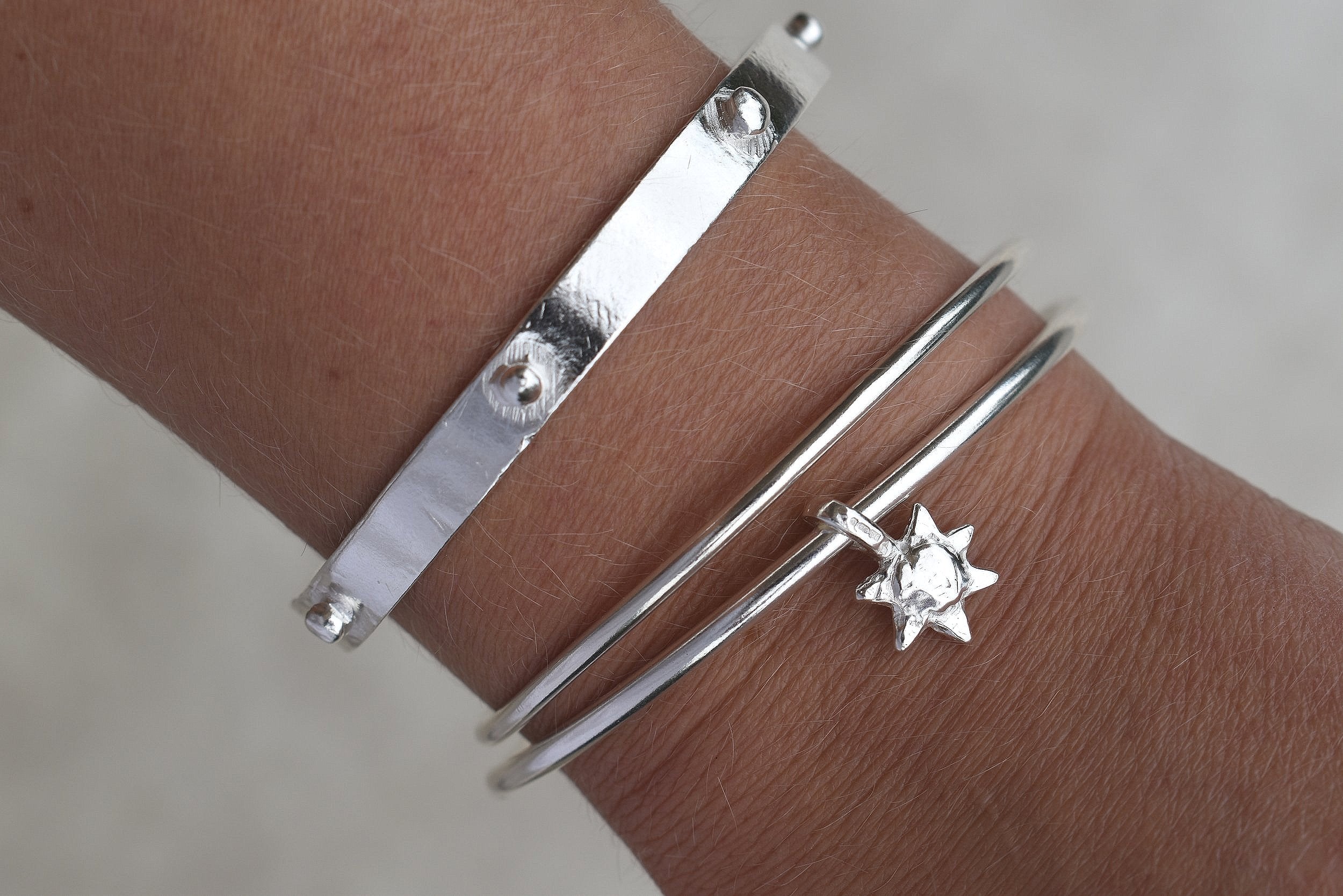 Solid silver round wire bangle with a mini sunshine charm. Can be worn alone or with a combination of other bangles from the collection. Round thick silver stack bangle silver cuff charm bracelet round solid silver bangle ladies bracelet with charm personalised word bracelet bangle stack silver