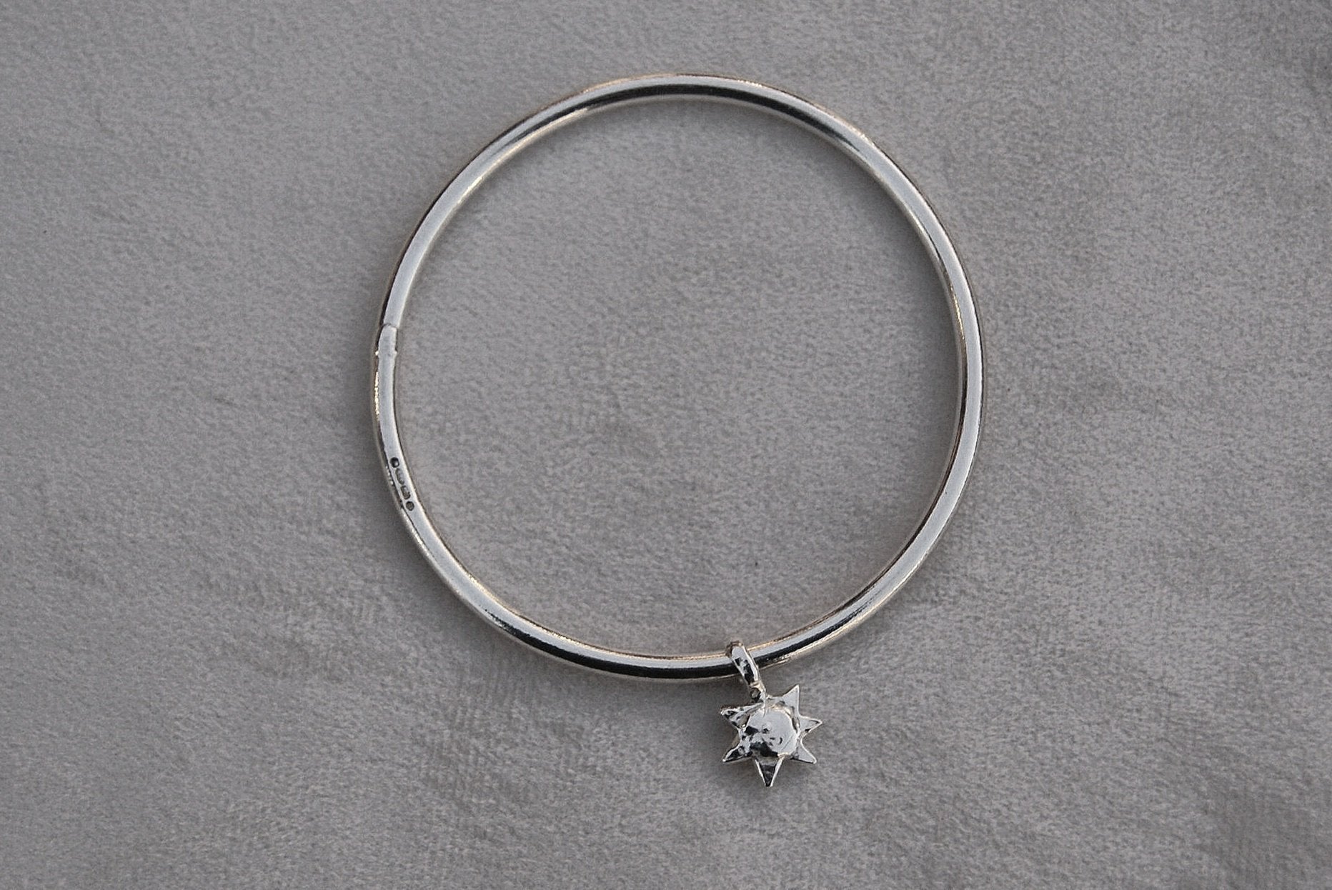 Solid silver round wire bangle with a mini sunshine charm. Can be worn alone or with a combination of other bangles from the collection. Round thick silver stack bangle silver cuff charm bracelet round solid silver bangle ladies bracelet with charm personalised word bracelet bangle stack silver
