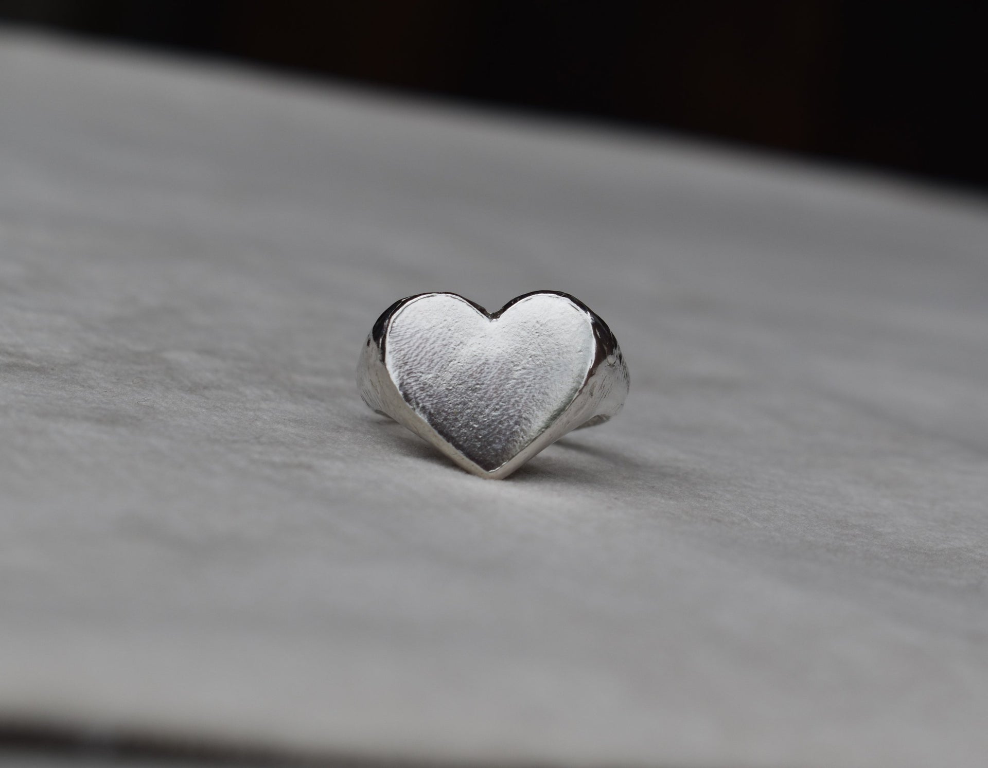 Classic love heart ring in silver. Luxury big chunky heart-shaped signet ring. Made from 100% recycled silver, hallmarked and stamped with individual maker’s mark. This heart ring is a perfect gift to the person that you love. Signature heart ring a timeless classic that goes with any style ladies statement heart signet ring