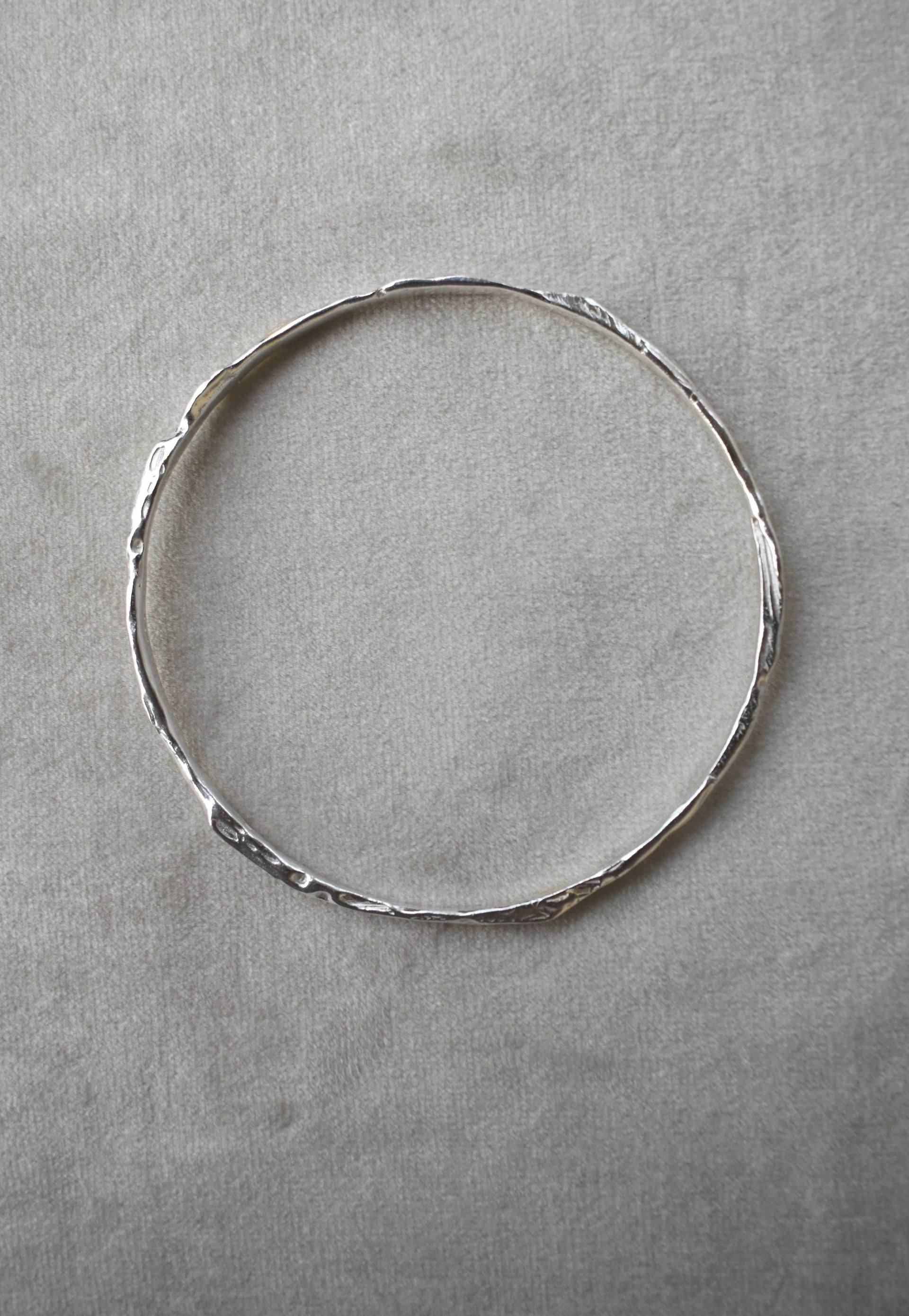 Solid silver round wire bangle nugget bangle organic texture bangle. handmade to order. silver bangle stack. Can be worn alone or with a combination of other bangles from the collection. Round thick silver stack bangle silver cuff charm bracelet round solid silver bangle ladies bracelet with charm personalised word bracelet bangle stack silver. 