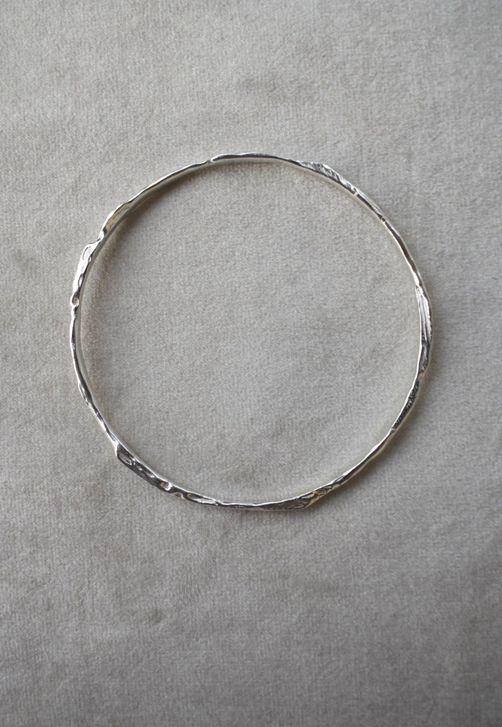 Solid silver round wire bangle nugget bangle organic texture bangle. handmade to order. silver bangle stack. Can be worn alone or with a combination of other bangles from the collection. Round thick silver stack bangle silver cuff charm bracelet round solid silver bangle ladies bracelet with charm personalised word bracelet bangle stack silver. 