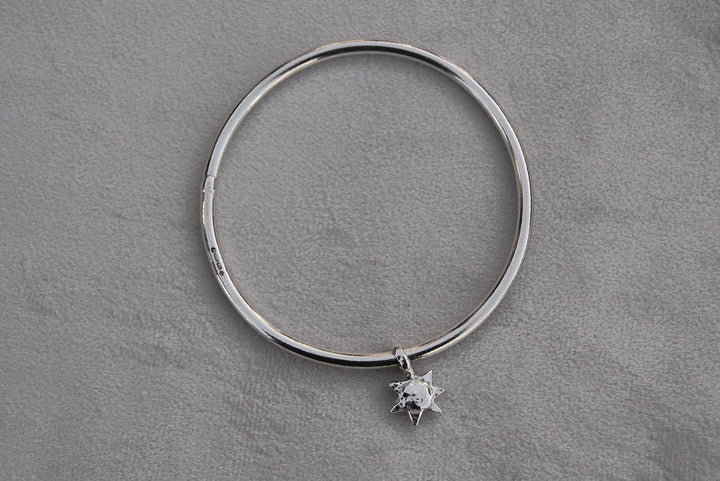 Solid silver round wire bangle with a mini sunshine charm. Can be worn alone or with a combination of other bangles from the collection. Round thick silver stack bangle silver cuff charm bracelet round solid silver bangle ladies bracelet with charm personalised word bracelet bangle stack silver