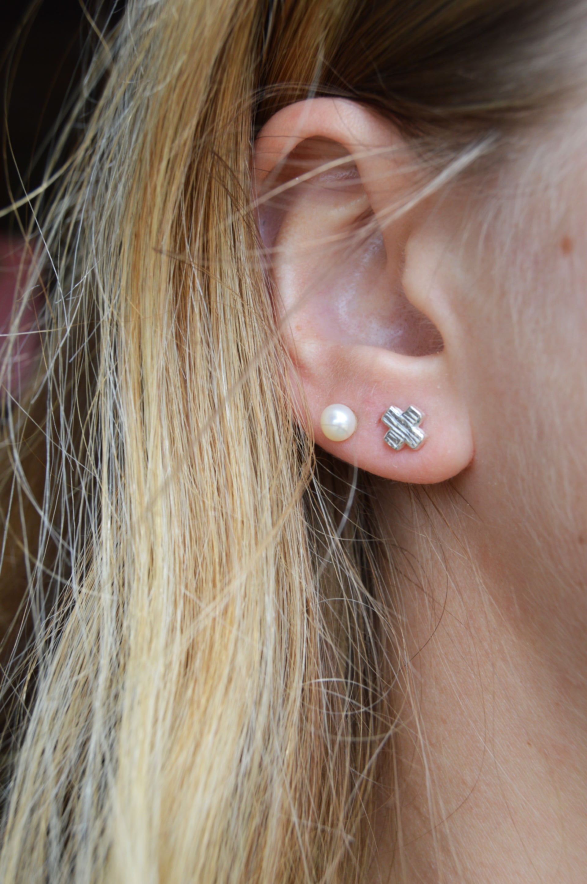 Silver X shape studs. From the noughts & crosses collection mini stud one size.
Mini XO shape stud charm silver earrings XO gift for her gift for him silver charm earrings